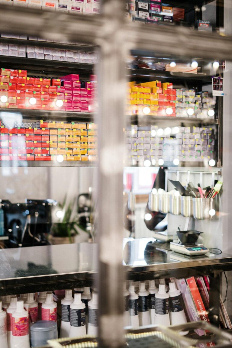 A vibrant hair salon showcasing neatly organized hair coloring products and tools.